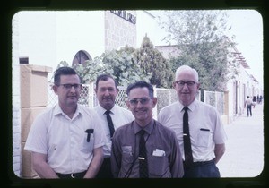 Group of men outside Iglesia de Cristo