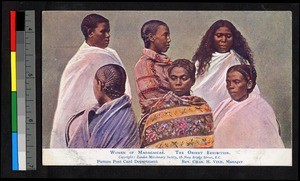 Six young women gathered in white and colored wraps, Madagascar, ca.1909