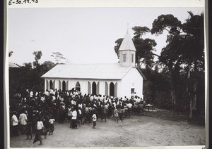 Ceremonial consecration of the church in Edea. The congregation streams into the church