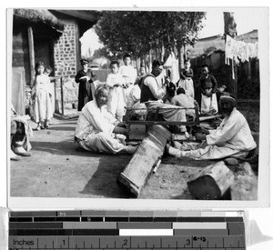 Two Korean men sawing a log, Korea, ca. 1920-1940