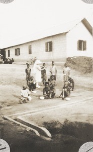 Patients washing wounds, E. Godfrey binding one, Nigeria, ca. 1925