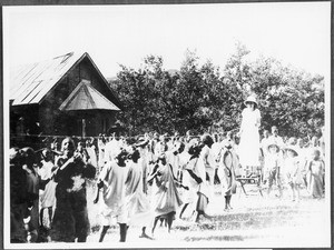 Children's party: boys snapping at cakes, Gonja, Tanzania, ca. 1927-1934