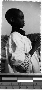 Close-up view of a boy praying outside, Africa, March 8, 1948