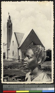 Young woman near church, Congo, ca.1920-1940