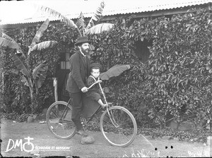 Man and child on bicycle, Pretoria, South Africa, ca. 1896-1911