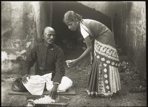 A woman serving her husband