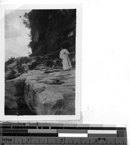 A Maryknoll Sisters on a rock mountain at Guilin, China, 1948