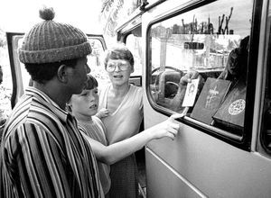 Anne Vibeke Mandrup is selling Bibles and other religious literature. The boy is Thomas Mandrup)