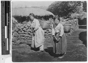 Two Korean women carrying water jugs, Korea, ca. 1920-1940