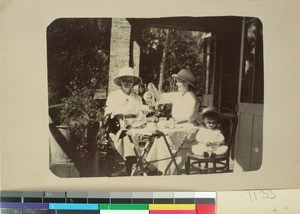 A coffee party on Anne Ringstad's porch, Farafangana, Madagascar, ca.1923