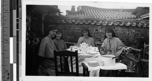 Four Maryknoll Sisters sitting down to a meal, Peng Yang, Korea, ca. 1920-1940