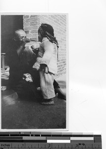 A child being fed at Luoding, China, 1937
