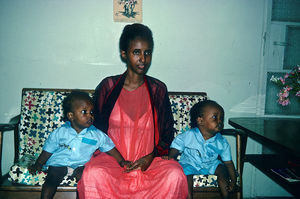 Sadaqa, assistant to the teaachers in the school, with her two kids in 1966