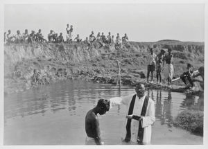 East Pakistan (from 1971 Bangladesh), ca. 1967-68. Baptism in the water pond, by Rev. Josef?