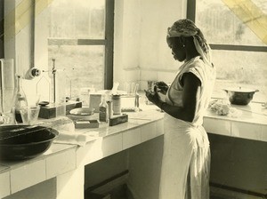 Woman working in a laboratory, in Ebeigne, Gabon