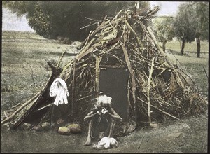 A leper in his hut