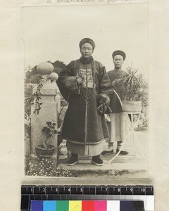 Mandarin and attendant, south China, ca. 1888-1906