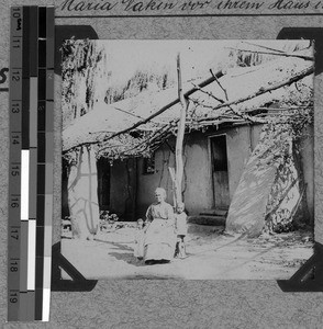 Maria Nakin in front of her house in Emtumasi, South Africa East