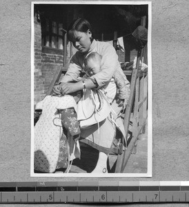 Tying bibs on children at Harwood Bible Training School, Fenyang, Shanxi, China, ca.1936-37