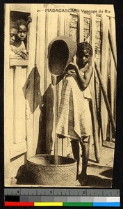 Young girl winnowing rice, Madagascar, ca.1920-1940