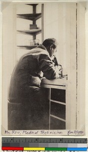 Medical technician at Ellen Lavine Graham Hospital, Haizhou, China, ca. 1917-1920