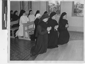 Sisters pray in church at Jiangmen, China, 1947