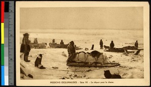 Huntsmen standing with their dogs and sleds on a flat snowy plain, Canada, ca.1920-1940