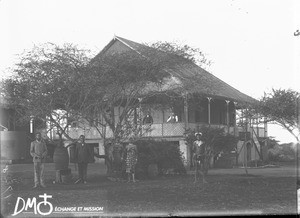 Group of people in front of the mission house, Makulane, Mozambique, ca. 1896-1911