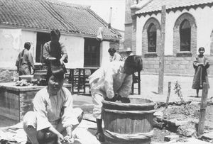 Busy Saturday afternoon in Chinchou. The young washes clothes