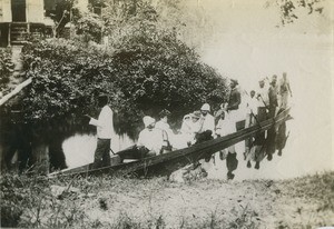 Missionaries in a pirogue, in Gabon