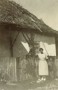 A woman in front of a building of Moria Health center