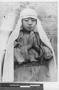 A girl dressed for a Christmas play at Fushun, China, 1940