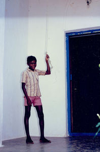 East Jeypore, Orissa, India. One of the hostel boys serving the bell at Gunupur Church