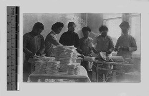 Student nurses preparing first aid supplies, Beijing, China, 1911