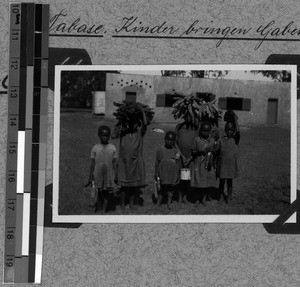 Children bringing gifts for the harvest festival, Tabase, South Africa East, 1932