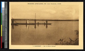 Missionary father travels by boat in the Oueme river, Benin, ca. 1900-1930