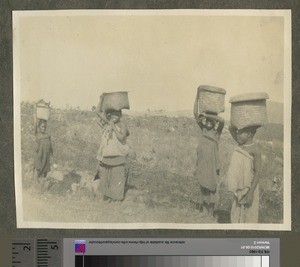 African girls carrying crop to market, Malawi, ca.1926