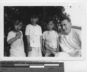 Fr. Cuneen with children at Wuzhou, China, 1941