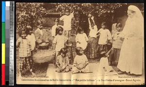 Children picking oranges with a missionary, India, ca.1920-1940