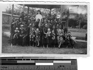 Maryknoll Sisters and nurses with children at Luoding, China, 1937