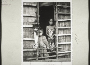 "Non-christian children in the door of a hut (see explanation on rear