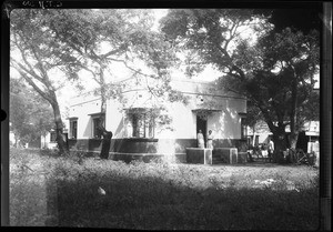 Women of European origin standing in front of the entrance to a building, Chamanculo, Maputo, Mozambique, ca. 1940