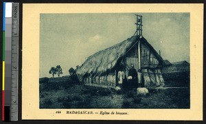 Missionary father with two boys in front of a chapel, Madagascar, ca.1900-1930