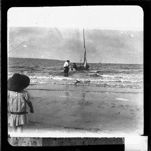 European woman embarking on a small boat, Catembe, Mozambique