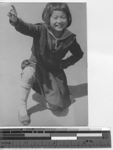 A young girl dancing at Shanchengzi, China, 1941