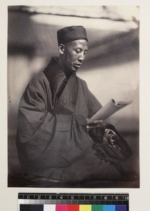 Portrait of Buddhist priest reading, Beijing, China, ca. 1861-1864