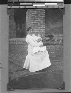 Sister Franke with baby, Kyimbila, Tanzania, ca. 1904-1915