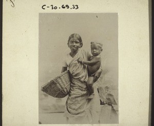 Tamil woman with child. India