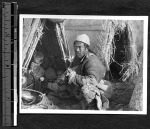 Famine refugees in huts near campus of Shantung Christian University, Jinan, Shandong, China, 1927