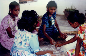 East Jeypore, Gunupur. Missionary Kæthe Andersen's foster child, Lina (far right) playing at th